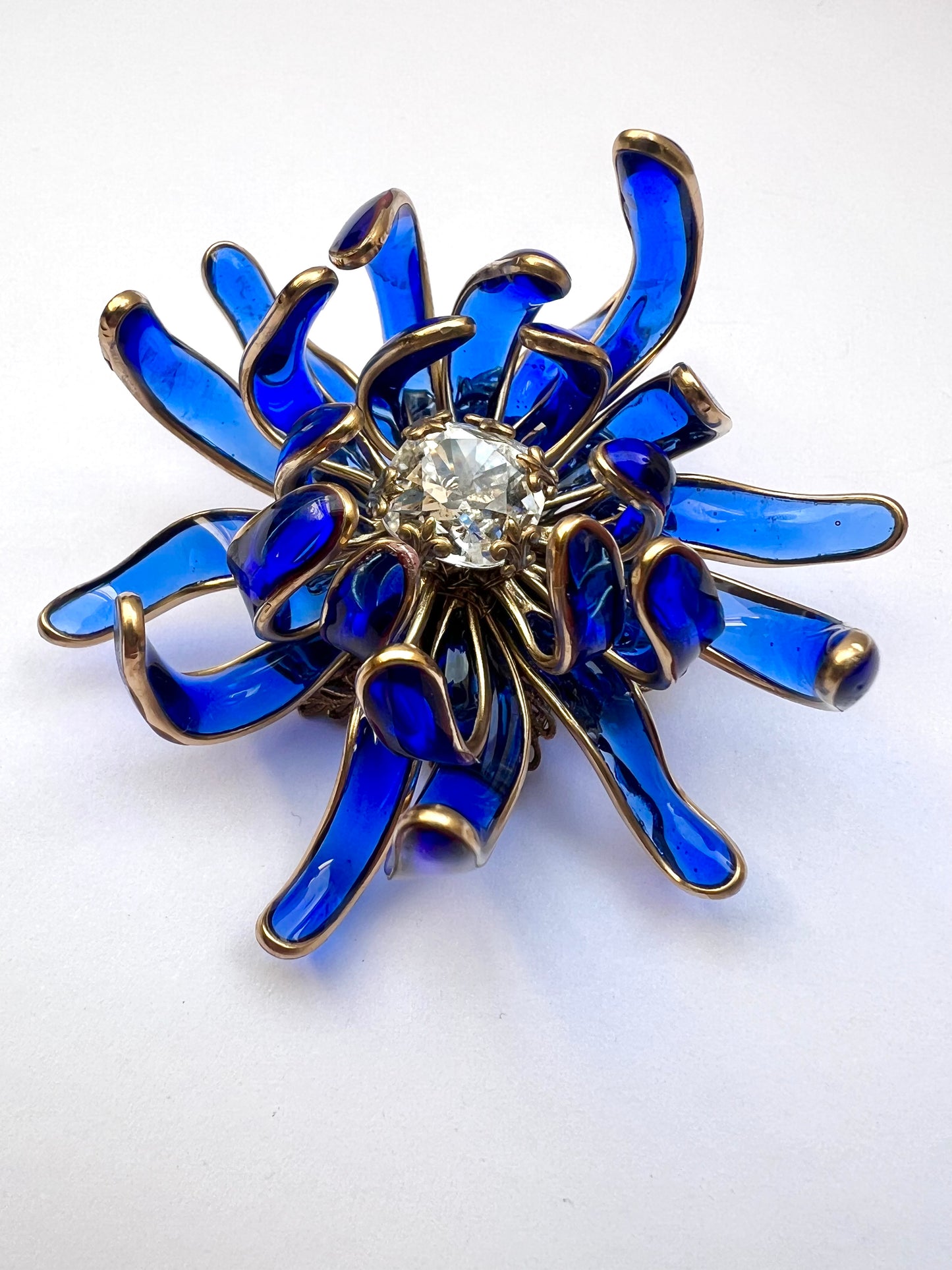 Chrysanthemum poured glass brooch in Bristol blue